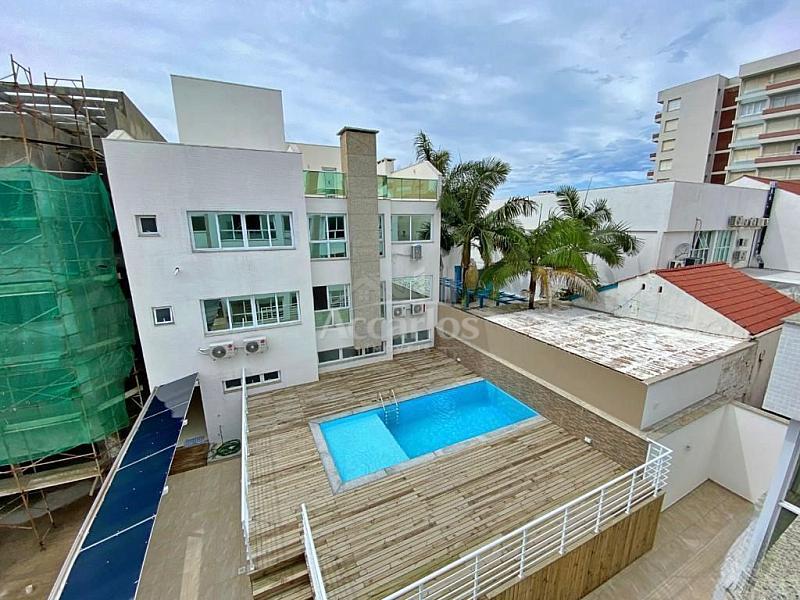 Localizado na mais bela praia ga�cha, a poucos metros da Praia Grande.  Apartamento com 01 dor 12