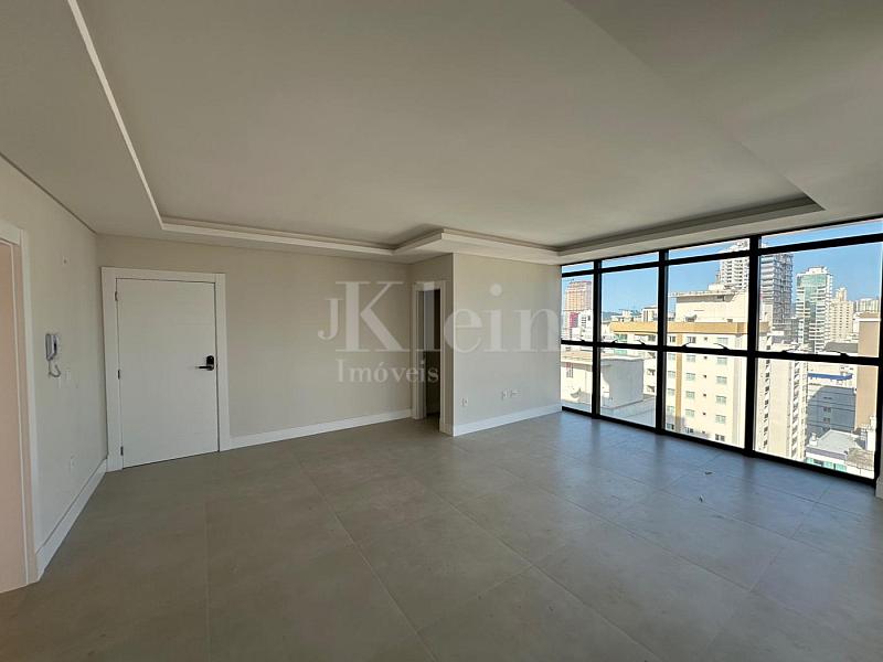 Living do apartamento do Times Square em Itapema