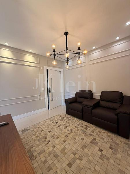 Living do apartamento no Edif�cio Portland Park Residenceem Porto Belo